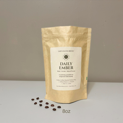 8oz Coffee package labeled 'Daily Ember' by Earth Blend Brews on a plain background