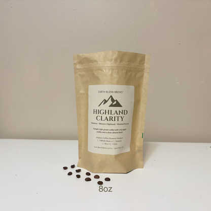 8oz Kraft paper coffee bag labeled 'Highland Clarity' with coffee beans on a white surface and beige background