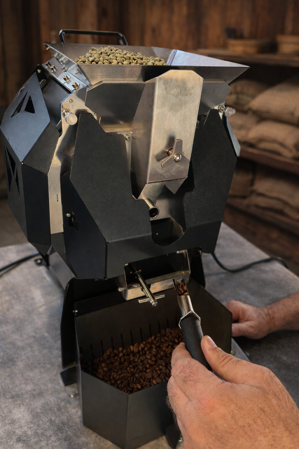Coffee roasting machine with coffee beans being poured into it