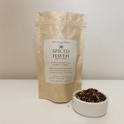 Spiced Haven tea package with a small bowl of tea leaves on a white surface