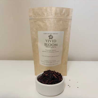 Tea packaging labeled 'Vivid Bloom' with a bowl of tea leaves on a white surface.